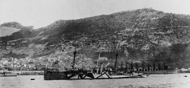 Ship in foreground is still wearing its disruptive camouflage from WWI, the one Jupiter is in the background